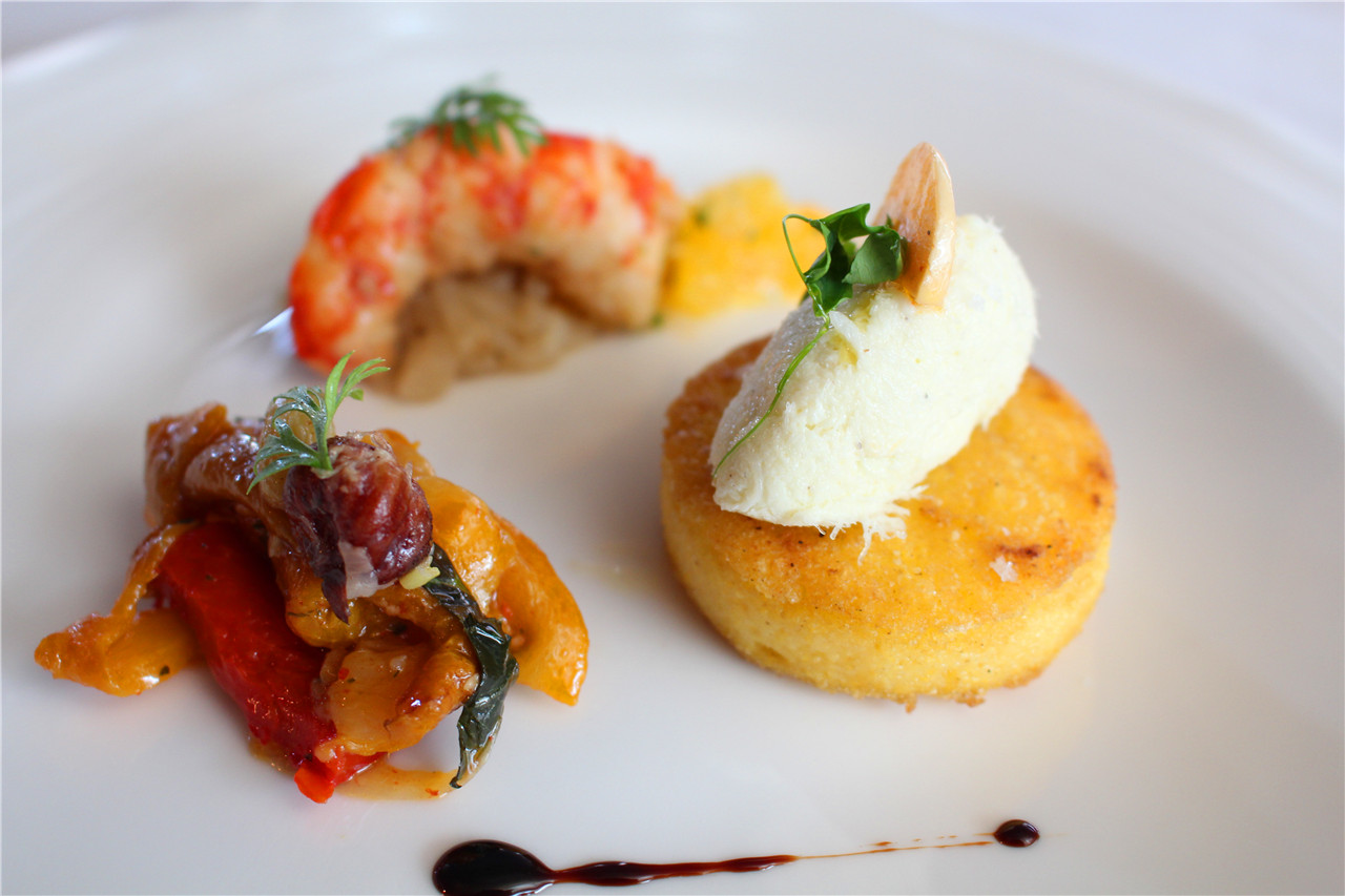 Shrimp with onion, nuts and dried grapes, cod fish mousse with roasted polenta and red pepper compost